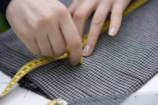 Tailor making measurements on trousers