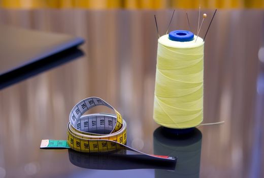 Spools of threads standing on the table