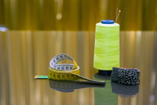 Spools of threads standing on the table