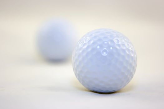 Two golf balls on white background