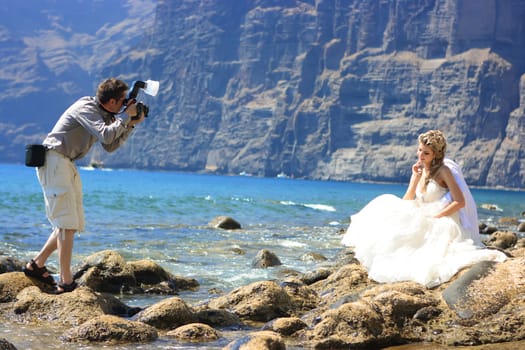 Photographer taking a shot of an angel fiancee