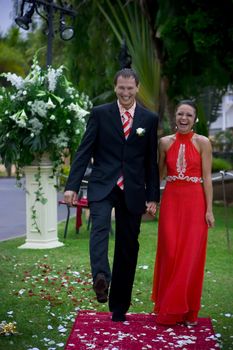 Just married extravagant couple going on red carpet