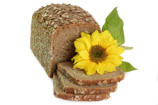 Sliced multigrain bread with sunflower blossom on white background