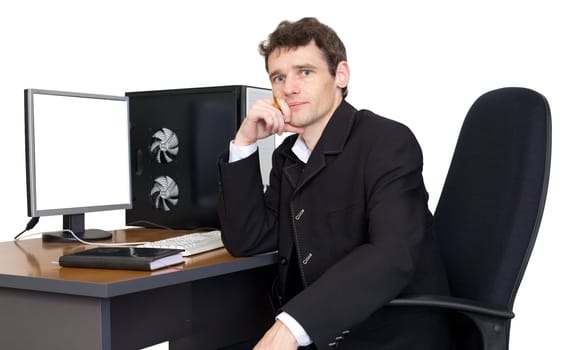 The businessman on the workplace near the computer