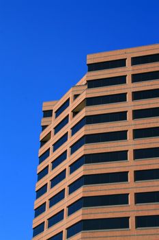 Close up of a modern building over blue sky.
