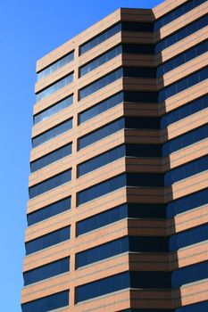 Close up of a modern building over blue sky.
