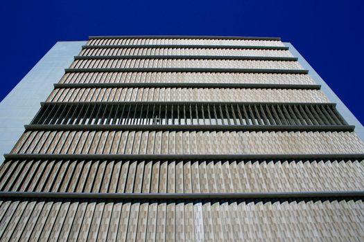 Close up of a modern building over blue sky.
