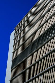 Close up of a modern building over blue sky.
