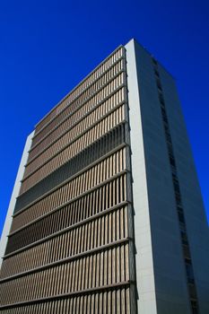 Close up of a modern building over blue sky.
