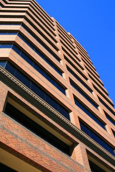 Close up of a modern building over blue sky.

