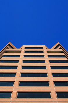 Close up of a modern building over blue sky.
