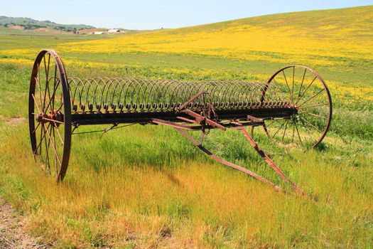 Close up of an old farm plow.
