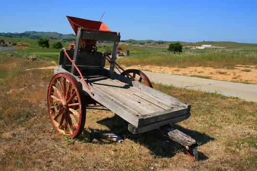 Close up of an old farm cart.
