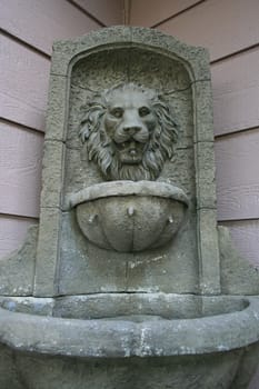 Lion head fountain showing unique design and details.
