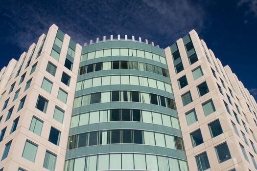 Highrise modern office building against blue sky
