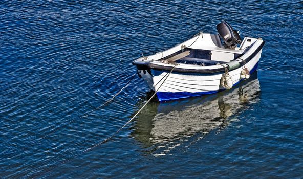 Boat at sunset on the portugal coast, in the Lagos ford.