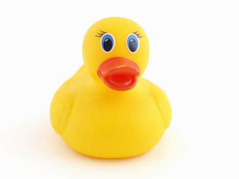 A small yellow rubber duck isolated against a white background.