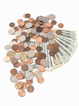 US Bank notes fanned out with different denominations, and US coins spilled over the top. Studio isolated over a white background.