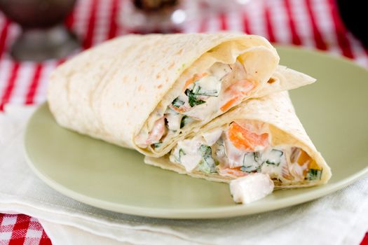 Wrap filled with fresh vegetables and smoked chicken