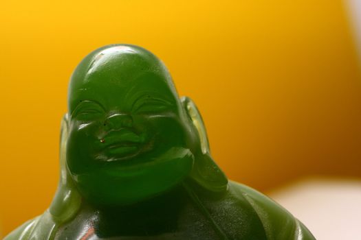 Jade statue of a laughing fat buddha, close up