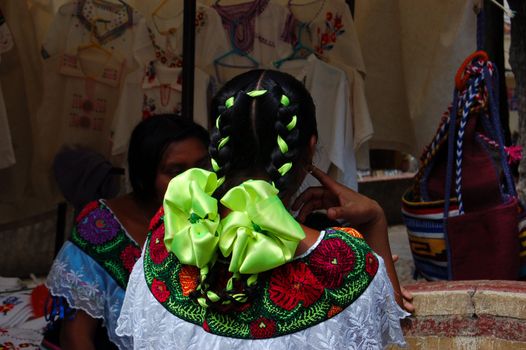 Mayan girl with green hair ribbon