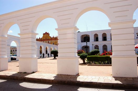 Arches with a Church in background in Chiapas, Mexico