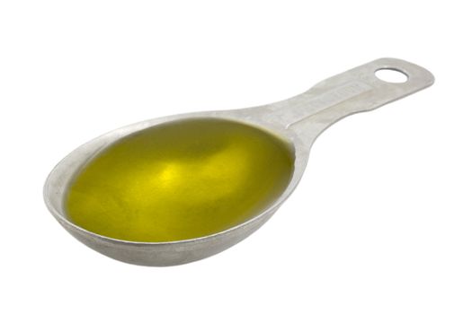 Measuring tablespoon of olive oil isolated on white, clipping paths included