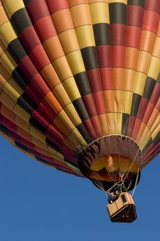 multicolor hot air balloon rising at Arkansas Valley Festival, Rocky Ford, Colorado, November 4, 2007