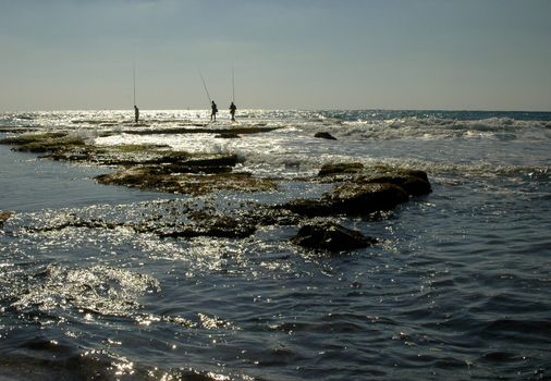 fishermens in the mediteranian sea in ceasarea israel