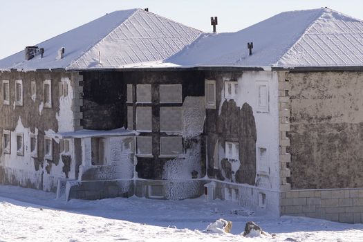 Abandon frozen house, cover in snow