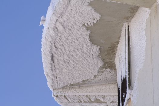 Roof of house with snow melting