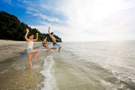 a group of friends having fun by the beach