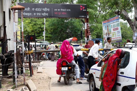 a road scene in India - tourist route - poor people surround tourist's car