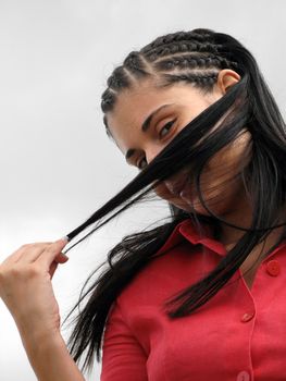 young woman covering face with her hair