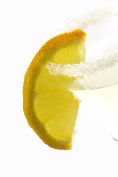Close up of a margarita with lemon slice in a glass