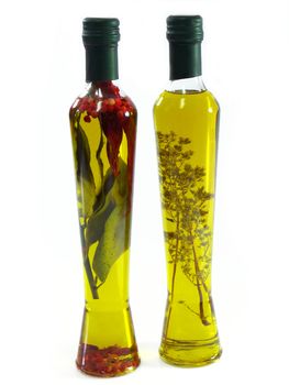 Extra virgin olive oil with herbs in bottles