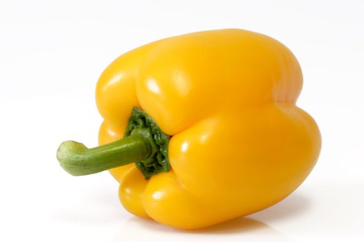 Close up of a yellow paprika on white background
