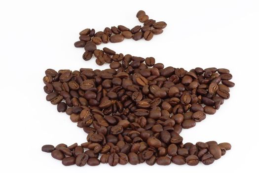 Shape of a cup from coffee beans on light background