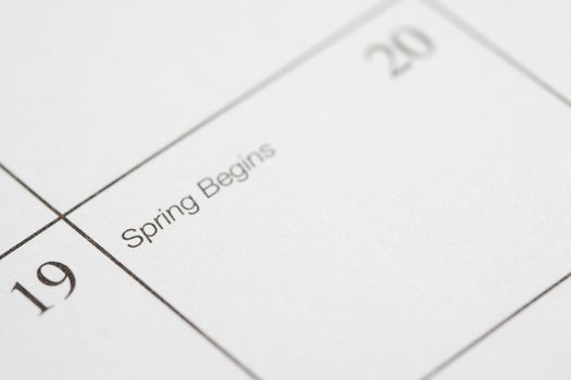 Close up of calendar displaying the beginning of spring.