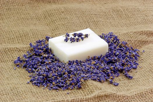 Perfume of lavender and soap on brown Background
