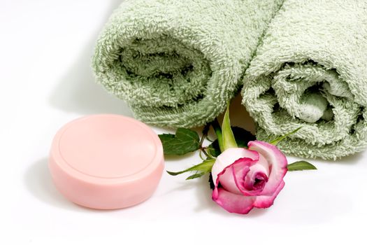 Towel and soap on a bright background