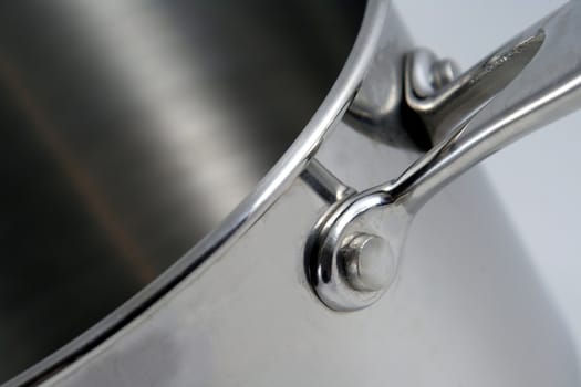 A closeup of a stainless steel pot.