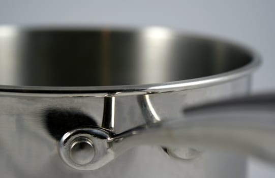 A closeup of a stainless steel pot.
