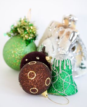 Collection of christmas tree toys on white background. Shallow depth of field