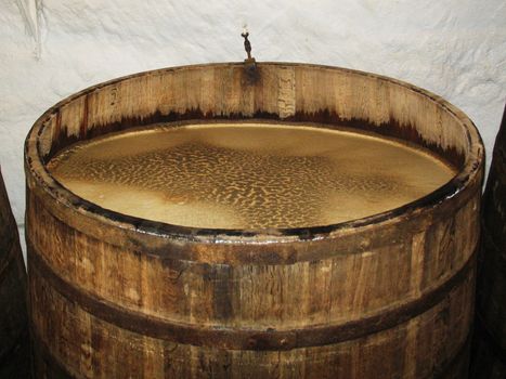 Big barrel full of aging beer in brewery storage Plsen Czech