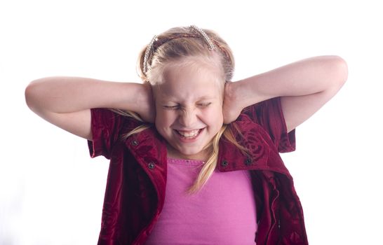 Girl covering her ears because it is too loud isolated on white