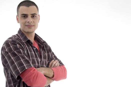 young man with crossed arms on an isolated white background