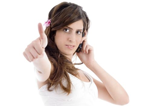 woman with cell phone showing approval sign on an isolated background