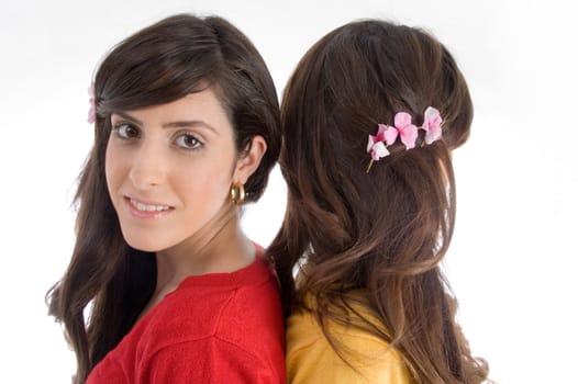 portrait of brunette sisters on an isolated white background