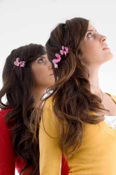 young friends with flowers and looking upward  with white background